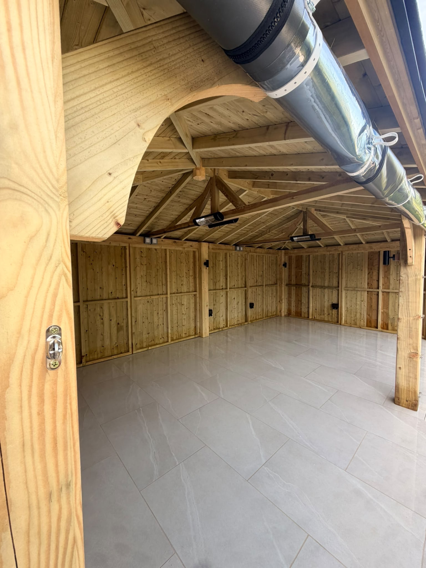 Inside the timber garden room with porcelain floor and power sockets